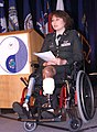 US representative Tammy Duckworth, in a wheelchair with prosthetic limbs (behavior: inclusion of the disabled in society)