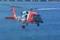 U.S. Coast Guard HH-60 retrieving a rescue swimmer