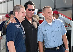 US Navy 050921-N-9274T-008 Wayne Newton poses for a photograph with U.S. Navy Air Traffic Controller Airmen Dustin Lee, left, and Teron Graeber before a USO concert for military personnel supporting Hurricane Katrina relief eff.jpg