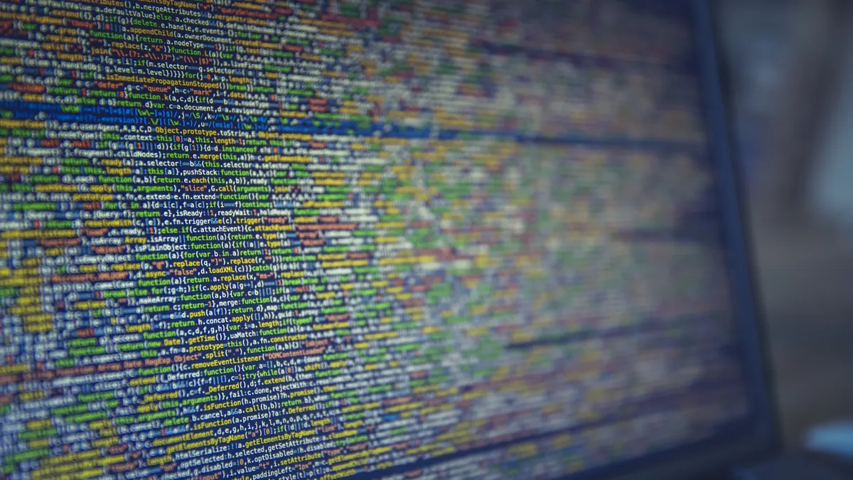 A closeup shot of long colorful lines of code on a computer screen.