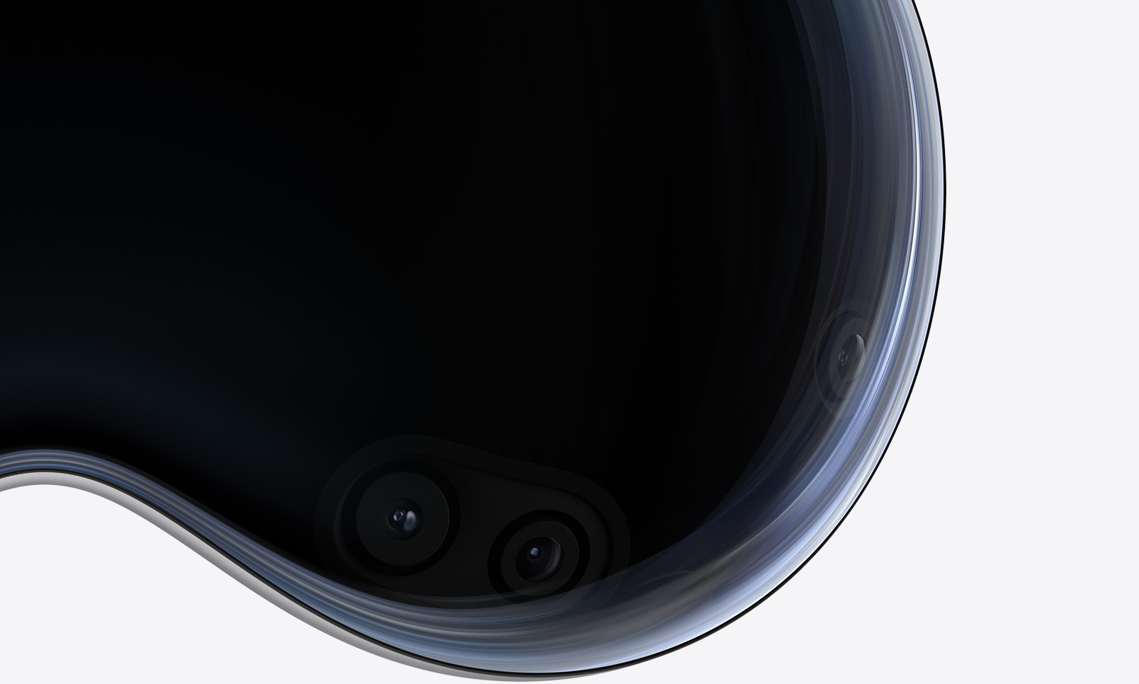 Close-up front view of Apple Vision Pro showing cameras and sensors behind the curved glass