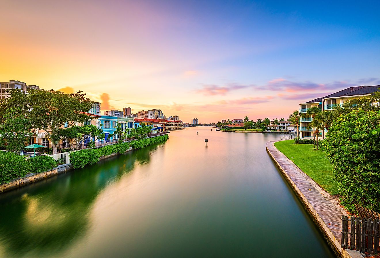 Naples, Florida, USA downtown cityscape on the canals at dusk.