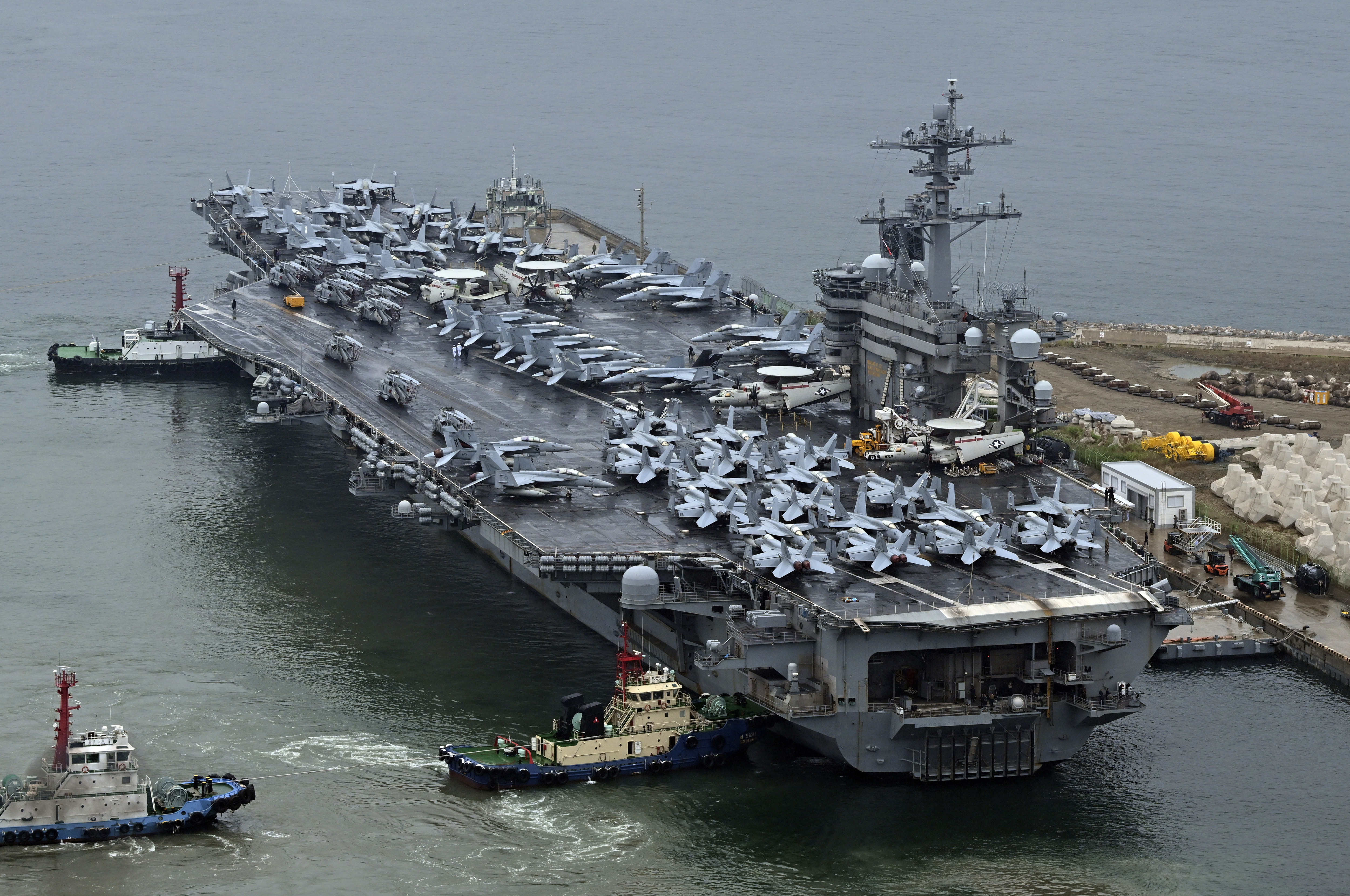FILE - The Theodore Roosevelt (CVN 71), a nuclear-powered aircraft carrier is anchored in Busan, South Korea, on June 22, 2024. The newly-inaugurated Freedom Edge exercise is wrapping up in the East China Sea, having brought together Japanese, South Korean and American naval assets for multi-domain maneuvers for the first time.(Song Kyung-Seok/Pool Photo via AP, File)
