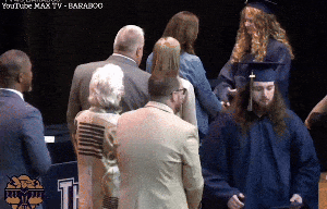 Graduation chaos as dad storms stage to stop daughter shaking super's hand
