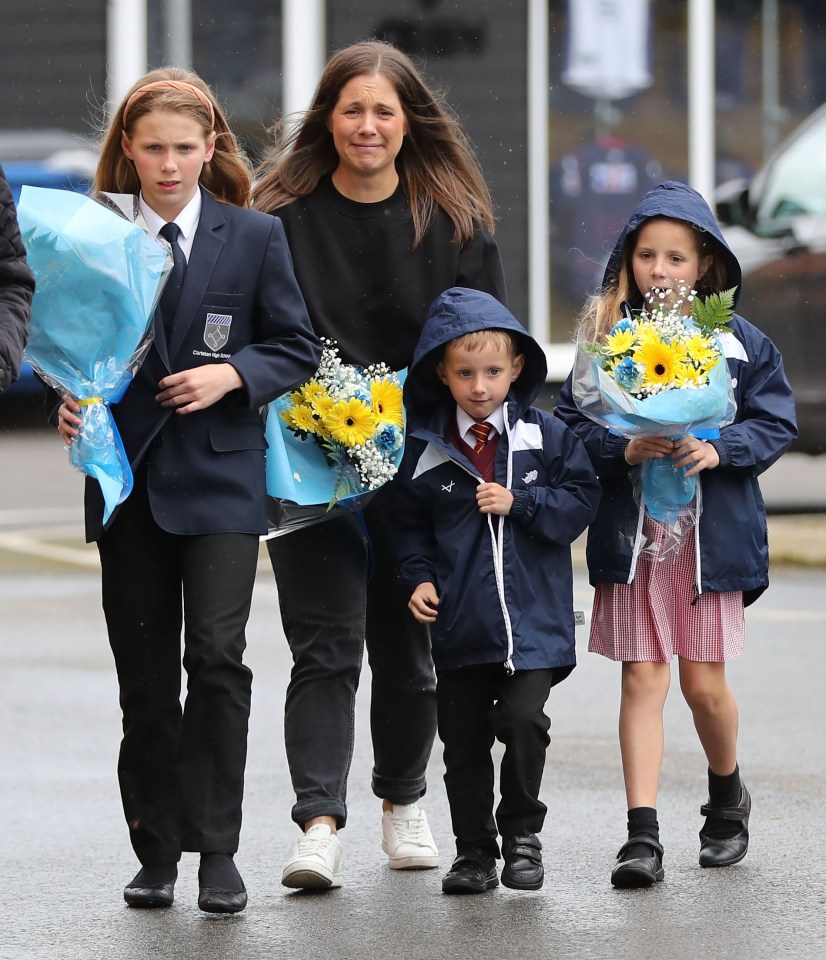 The Burrow family were emotional as they laid their own bouquets