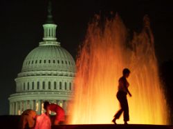 Woman walks on fountain near U.S. Capitol