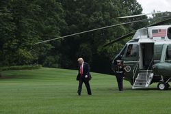 President Trump walks across the South Lawn from a helicopter in June 2017