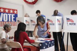 Voters voting in polling place