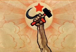 Symbols of communism: the hand wielding the hammer and sickle, in the background the rising sun and the red star.