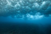 View of wave breaking from underwater.