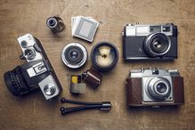 Photographic equipment, cameras, slides, lenses, rolls of film