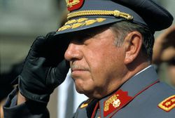 Military Dictator of Chile General Augusto Pinochet stands at attention.