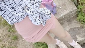 Pink skirt and blue panties outdoor wetting peeing