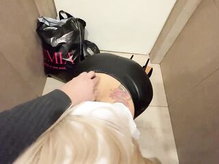 A salesgirl from a clothes store sucked off a customer's knob in the latrine of a mall