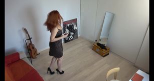 Redhaired MILF in a Black Skirt Takes a Sexy Selfie in Front of the Mirror