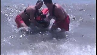Guy get his thick cock sucked by two lifeguards at same time