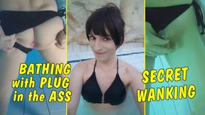 Tranny Girl with plug in her ass while bathing in thermal bath! Secret wanking!!