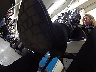 Candid MILF boots on train