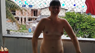 Wife works nude on balcony teasing her cuckold husband