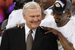 Los Angeles Lakers' Kobe Bryant gives basketball great Jerry West a shoulder rub after the Lakers beat the San Antonio Spurs 100-92 in Game 5 of the NBA Western Conference basketball finals, Thursday, May 29, 2008 in Los Angeles. (AP Photo/Kevork Djansezian)