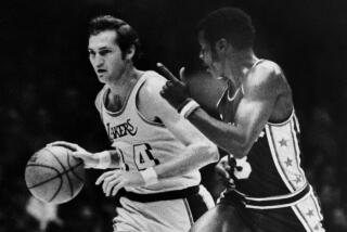 Fred Carter, Philadelphia 76er guards Laker Jerry West as they race down court on Dec.19, 1971.