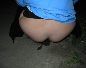 Drunk girl poses outside