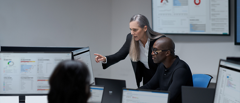 A person pointing at a computer screen