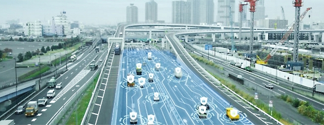 An image of a highway with cars driving on it.