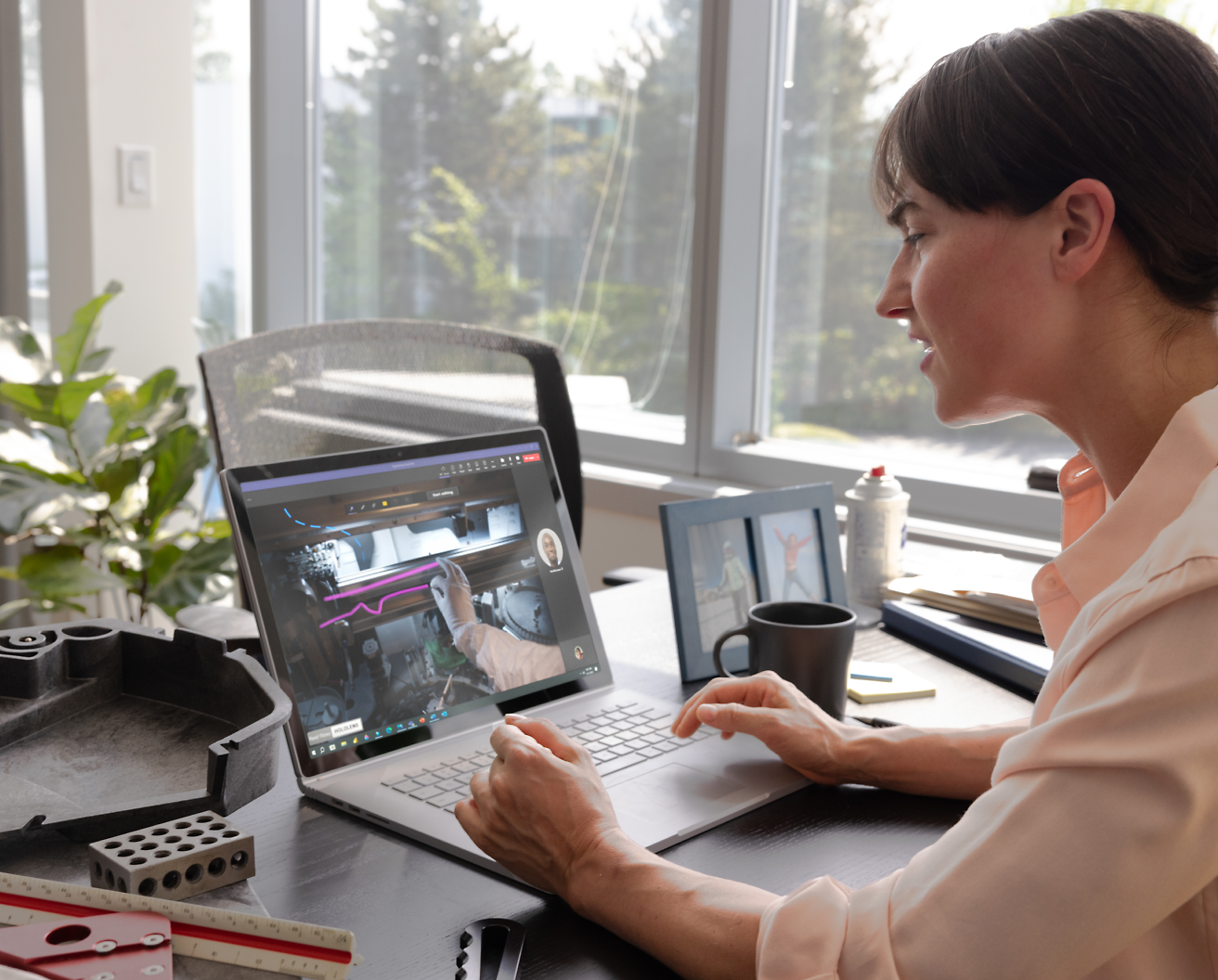 A person sitting at a desk using a computer