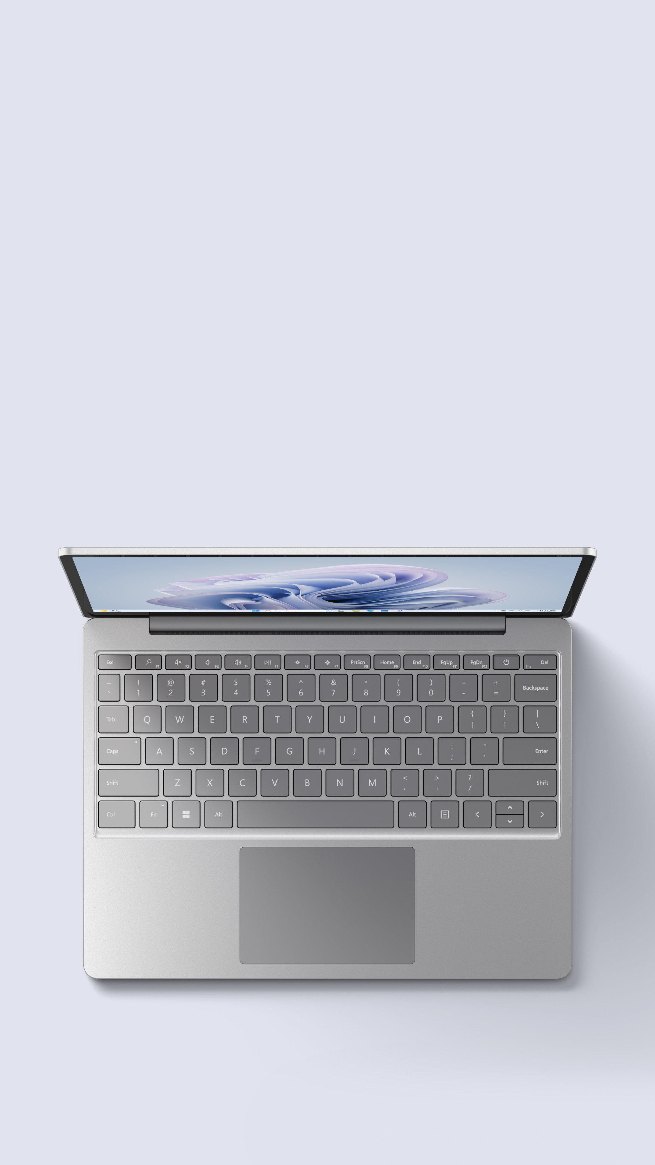 Surface Laptop Go 3 Platinum shown from above on a gray background.