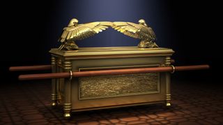 A digital rendering of the Ark of the Covenant, with gold, handles and winged eagles on the top.