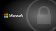 A Microsoft logo on a grey background with a padlock icon in a circle on the right