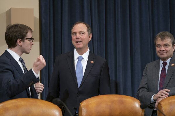 House Intelligence Committee Chairman Adam Schiff, D-Calif., center, joined at right by Rep. Mike Quigley, D-Ill., opens a hearing on politically motivated fake videos and manipulated media, on Capitol Hill in Washington, Thursday, June 13, 2019.  (AP Photo/J. Scott Applewhite)