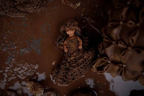 A doll covered with mud lies on the floor at the house of farmers Edite de Almeida, 51, and Joao Engelmann, 54, after floods at the Integracao Gaucha settlement, in Eldorado do Sul, Rio Grande do Sul state, Brazil, May 11, 2024. Record-breaking floods in southern Brazil, the result of weather patterns intensified by climate change, have only started to recede after displacing half a million people in the state of Rio Grande do Sul and killing more than 160. As the floodwaters began to retreat in recent weeks, Almeida got a first glimpse of her ravaged home, with the walls stained, appliances wrecked and belongings coated in mud. 