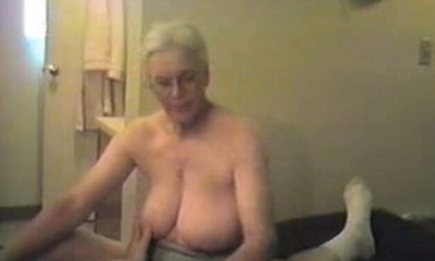 Busty Granny gives a sensual handjob