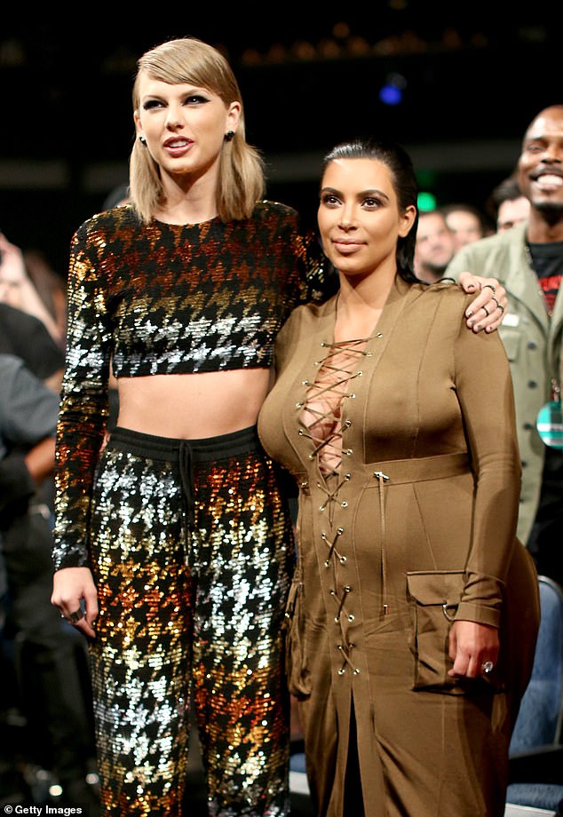 Taylor sings in one line: 'There's a bronze spray-tanned statue of you and a plaque underneath it/That threatens to push me down the stairs, at our school.' (pictured with Kim in 2015)