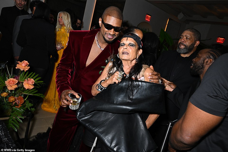 Usher posed with French fashion designer and Rick Owens' wife Michèle Lamy