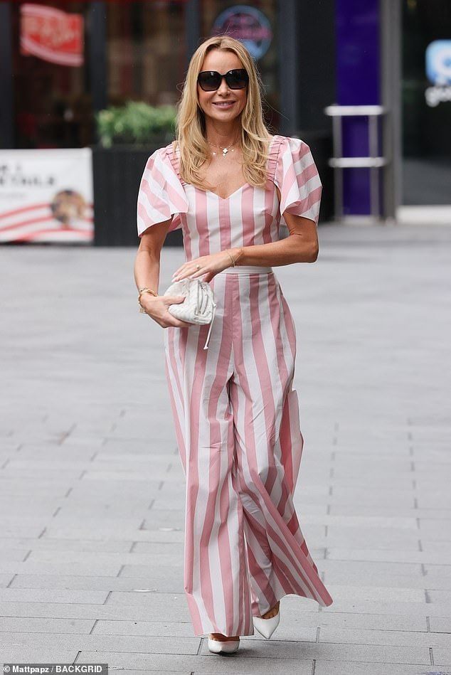 Amanda Holden looked sensational in pink and white striped trousers as she turned up to work at Heart FM for her breakfast show in central London on Tuesday morning