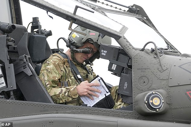 The Prince of Wales appeared focused as he read through a check list inside the cockpit of the Apache during an event at an army airfield in Hampshire