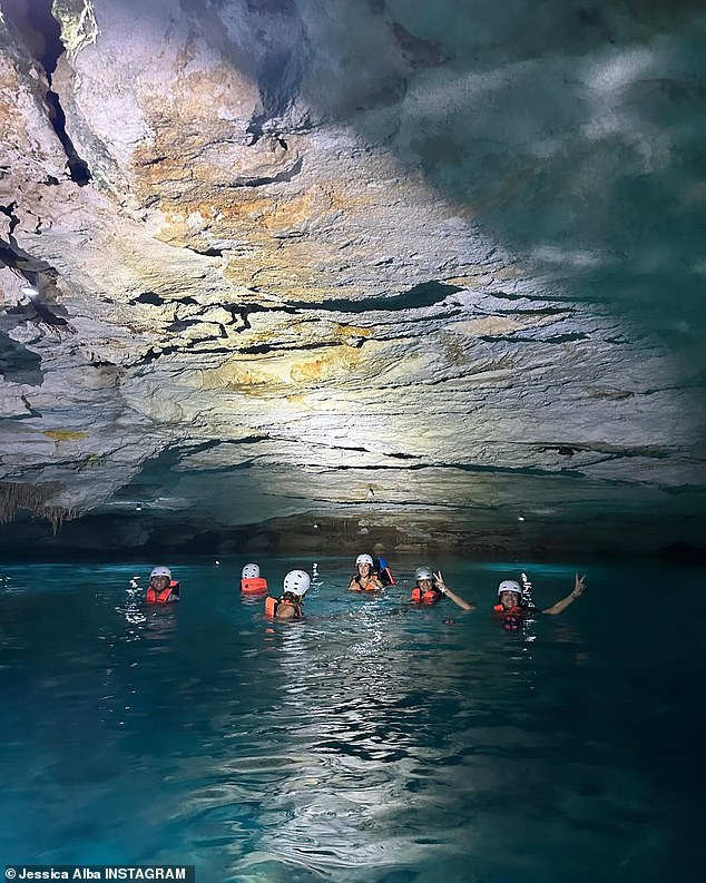 Further snaps showed Jessica and her travel companions inside the cenote as they explored the region wearing life vests and helmets