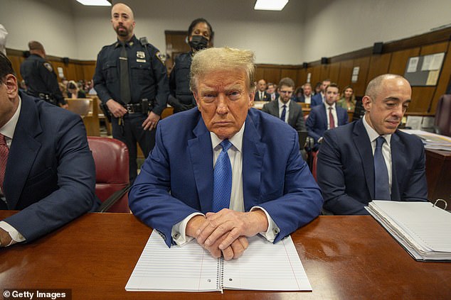 Donald Trump seated in the Manhattan criminal court room on May 20, 2024. He faces 34 counts of falsifying business records