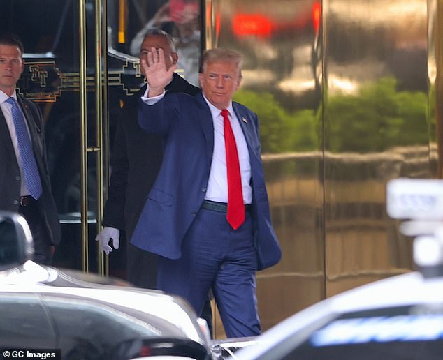 Trump waving has he heads toward his motorcade outside Trump tower in New York City. Each day of court the motorcade would make its way downtown to the criminal courthouse