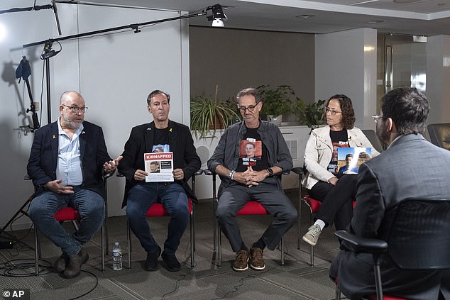 Families of Americans being held hostage by Hamas in Gaza, from left, Jonathan Dekel-Chan, Ruby Chen, Ronen Neutra and Orna Neutra, are interviewed by the Associated Press, Wednesday, June 5, 2024, in Washington