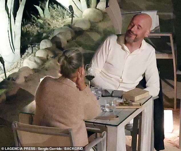 Erik ten Hag (right) cut a relaxed figure while on holiday with his wife, Bianca (left), in Ibiza