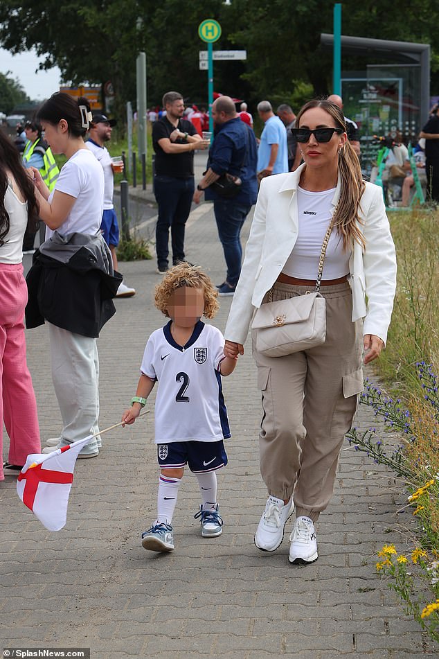 Lauryn Goodman takes her son Kairo to watch his father Kyle Walker for England yesterday