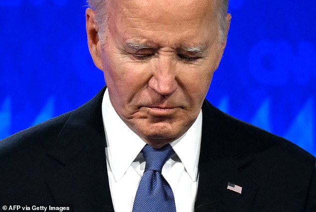 oe Biden looks down as he participates in the first presidential debate of the 2024 election