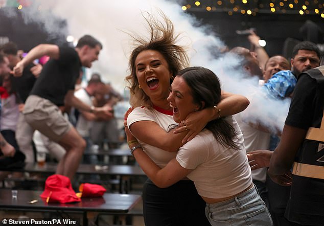 LONDON -- Fans hug and celebrate as Boxpark is sent into pandemonium