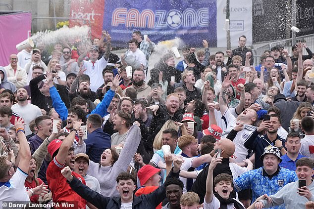 LEEDS -- Drinks fly into the air and shower fans underneath in jubilant scenes at Millennium Square