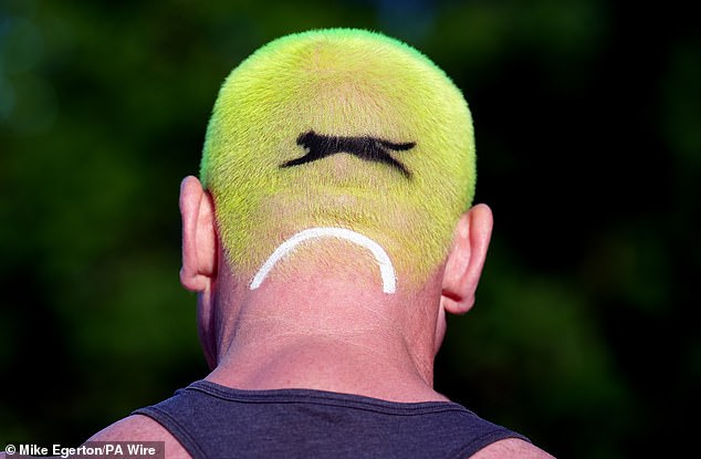 A person at Southfields station with hair in the style of a Slazenger tennis ball today