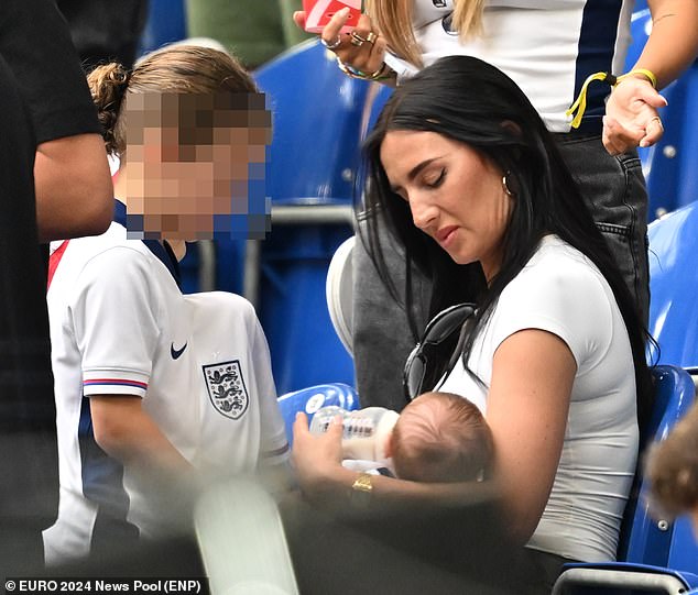 Annie was seen feeding the couple's baby son Rezon while Kyle and his teammates struggled to make an impact during the game until the final few minutes
